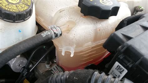 Why is my coolant reservoir full after driving?