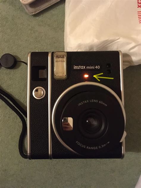 Why is my instax mini flashing yellow?