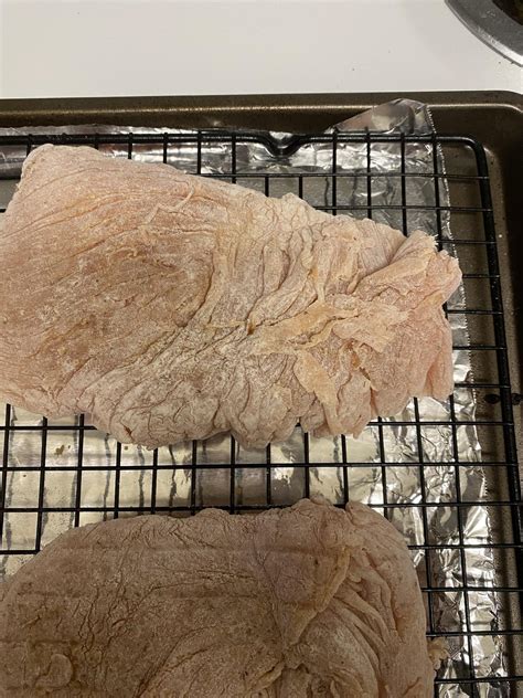 Why is raw chicken breast stringy?