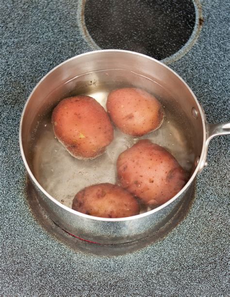 Why put potatoes in cold water to boil?