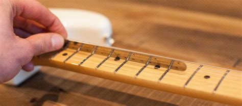 Will heavier strings stop fret buzz?
