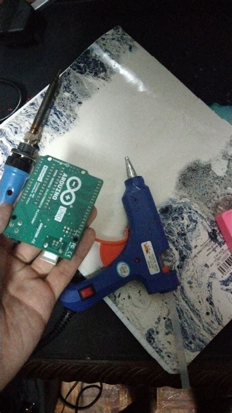 Will hot glue damage an Arduino?