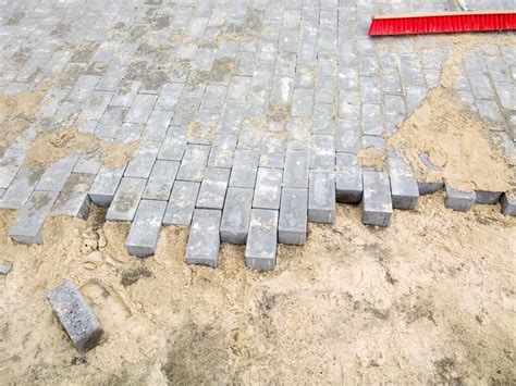 Will sand under pavers wash away?