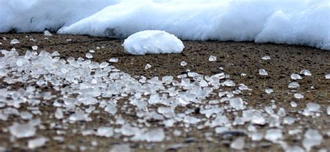 Will table salt melt ice on pavement?